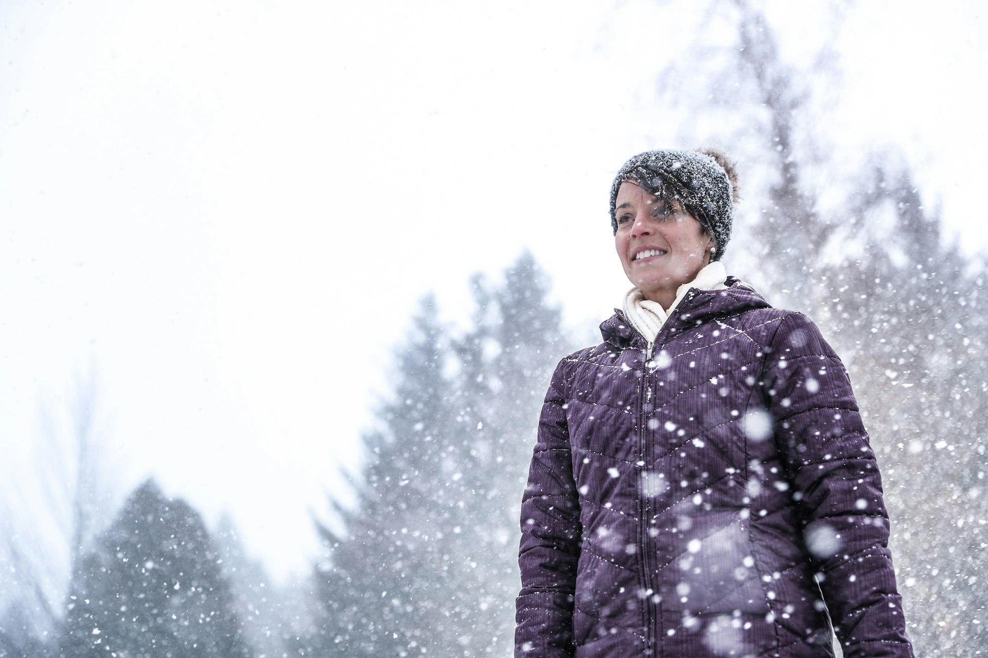 Women smiling with gently falling snow